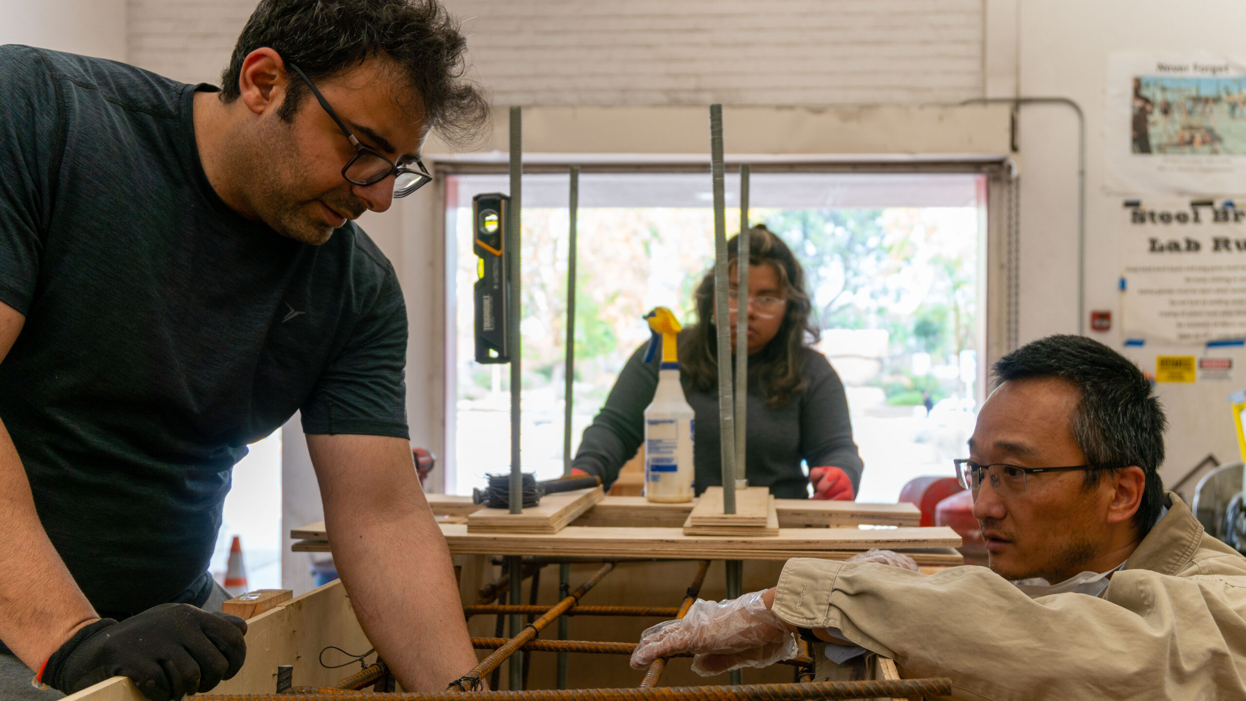 Dr. Shawn Sun working with a graduate student on a project.